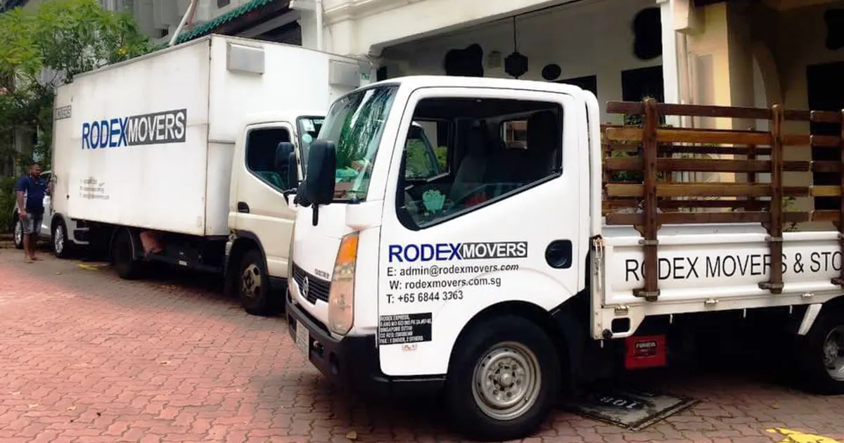 Rodex Movers lorries outside a shophouse