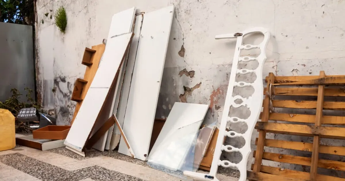 Old furniture and pallets stacked for disposal