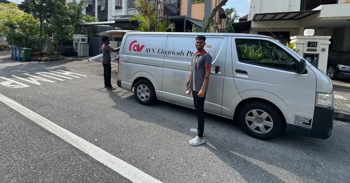 AVV Electrical van and electricians outside a landed home
