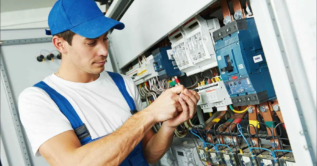 Wireman electrician working on a distribution board
