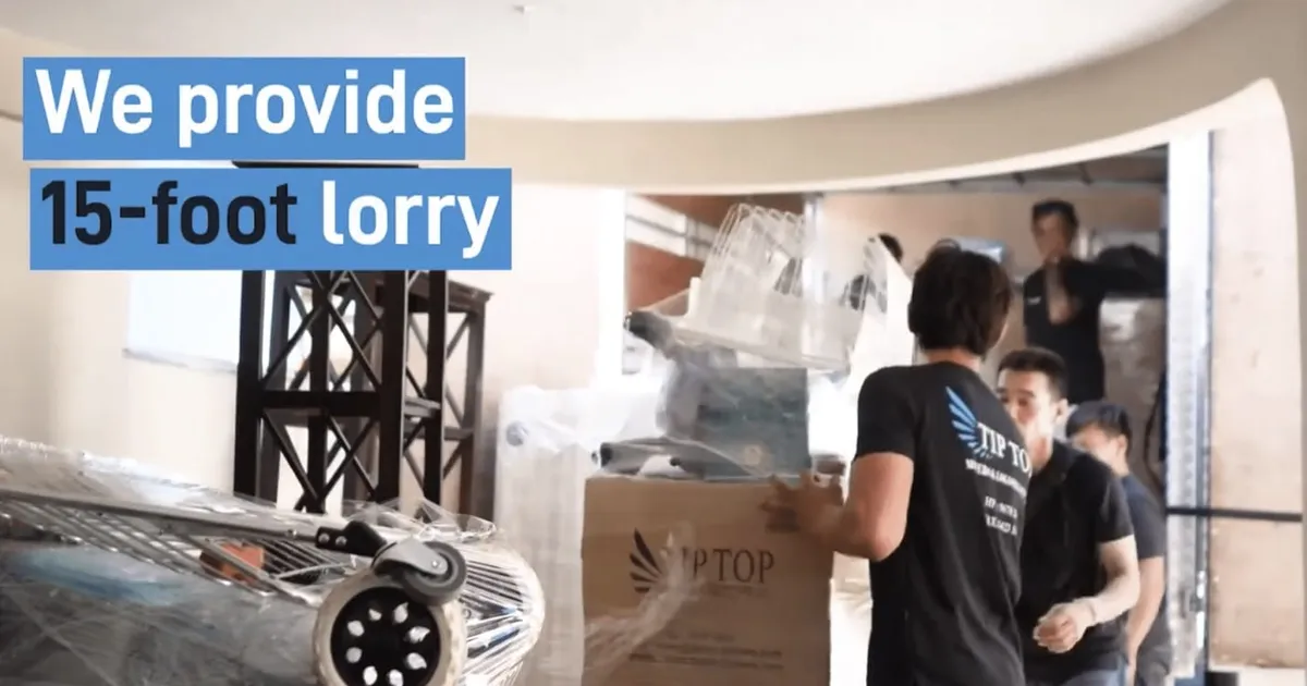 Tip Top Relocators crew loading boxes into a lorry
