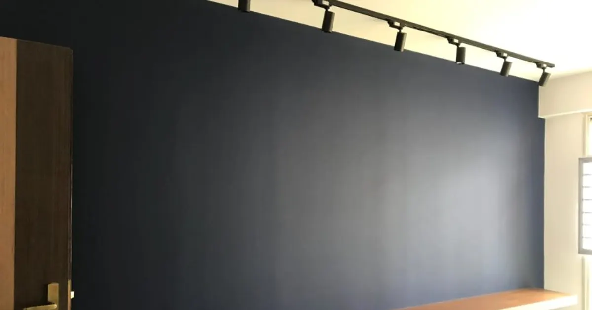 Freshly painted dark feature wall in an HDB flat