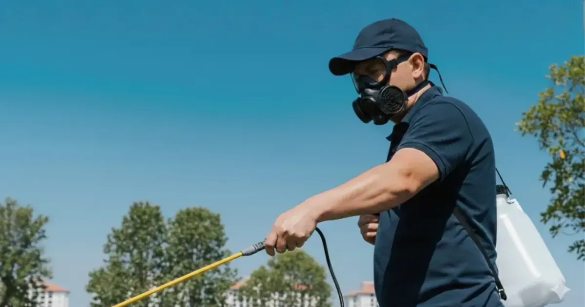 Fidz technician spraying outdoors